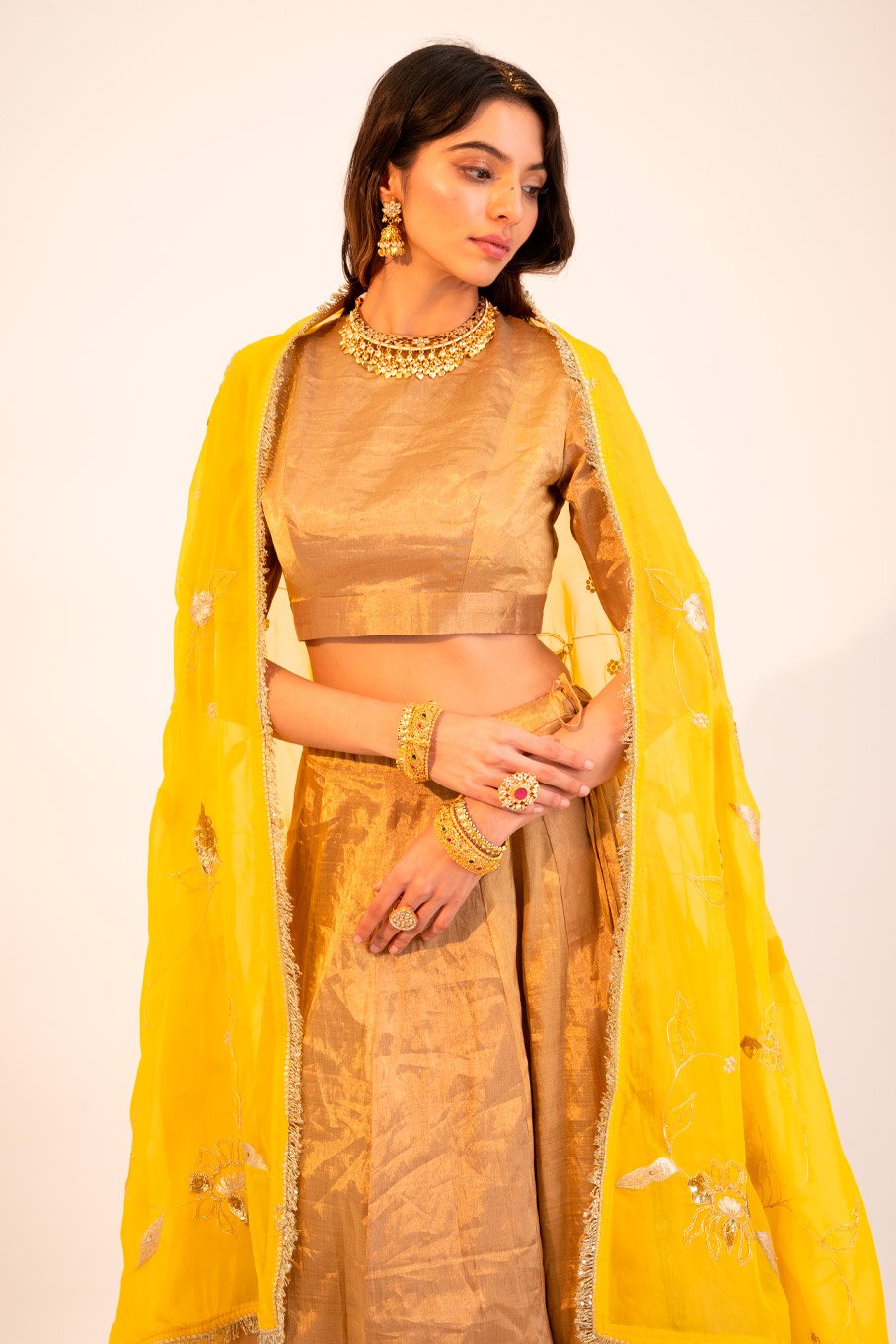 Signature Zari Tissue Gold Lehanga & Blouse Paired With Yellow Embriodered Organza Dupatta - Image 4